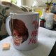 My only friend as I was trapped in the house sick—a Maxine Waters mug, lots of medicine and hot tea (Danielle Belton/The Root)
